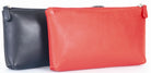 Navy and red makeup cases side by side, both zipped shut