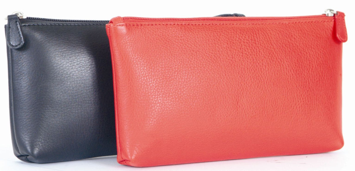 Navy and red makeup cases side by side, both zipped shut