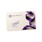 Purple Merchant eGift Card: a cream card printed with the daisy logo and "A gift for you", a purple ribbon curling down its right side.