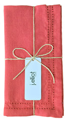 Ralph napkins folded and tied with a fine cord under a J.Elliot tag