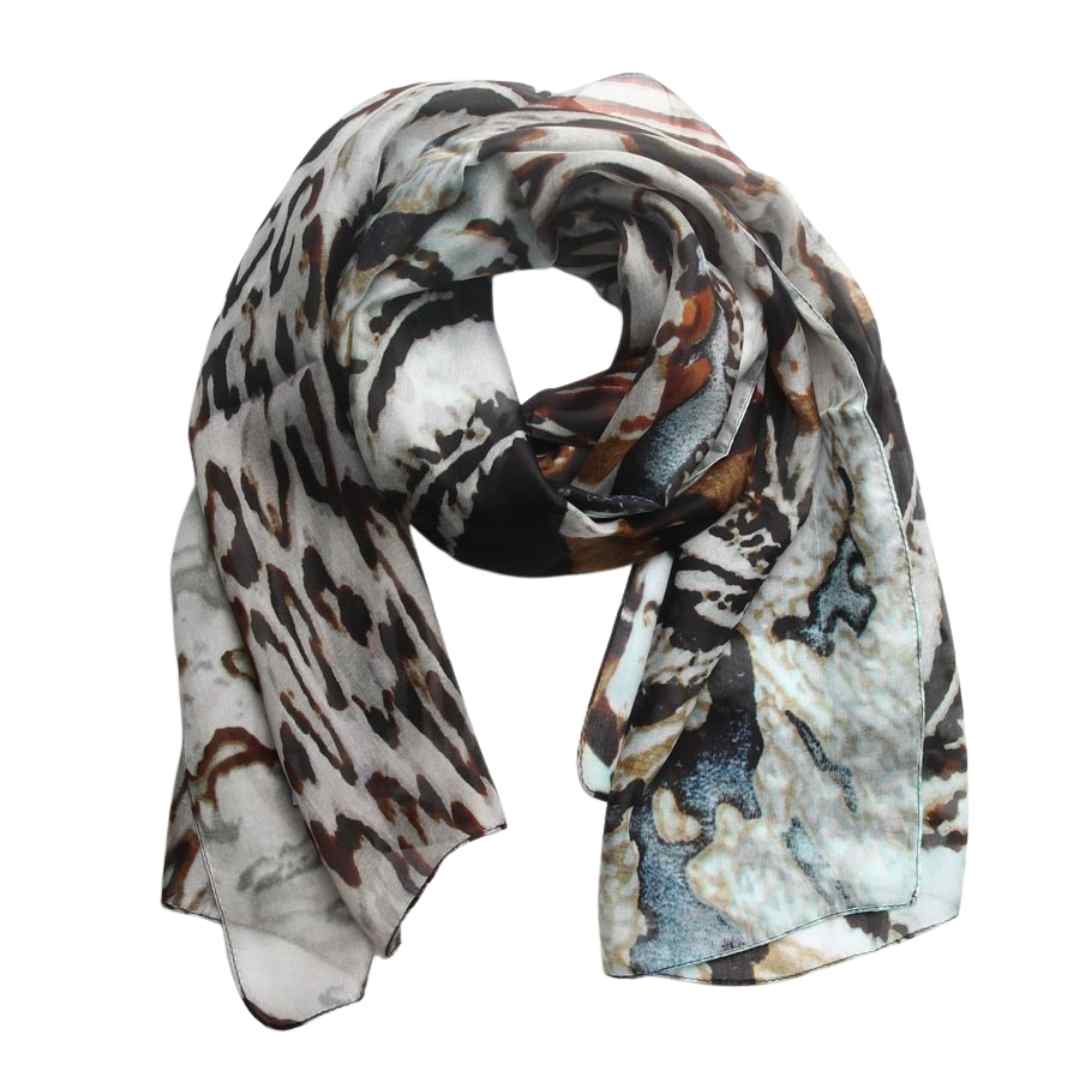 Safari Palm silk scarf in loose folds, a black, brown and white animal print