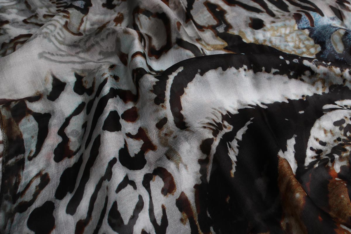 Close-up of the Safari Palm silk showing the spotted and striped animal print