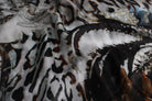Close-up of the Safari Palm silk showing the spotted and striped animal print