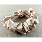Pale cream satin scrunchie scattered with small clear crystals