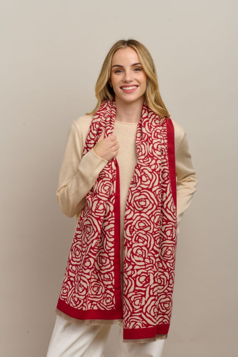 Model wearing the red Wild Rose scarf with a cream knit