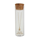 Selina gold-plated sterling silver letter H initial necklace in its cork-topped glass gift tube