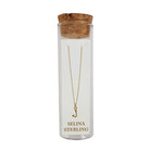 Selina gold-plated sterling silver letter J initial necklace in its cork-topped glass gift tube