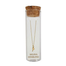 Selina gold-plated sterling silver letter P initial necklace in its cork-topped glass gift tube