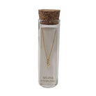 Selina gold-plated sterling silver letter Y initial necklace in its cork-topped glass gift tube