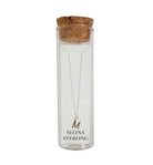 Selina sterling silver letter M initial necklace in its cork-topped glass gift tube