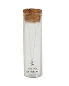 Selina sterling silver letter S initial necklace in its cork-topped glass gift tube