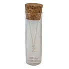 Selina sterling silver letter Z initial necklace in its cork-topped glass gift tube