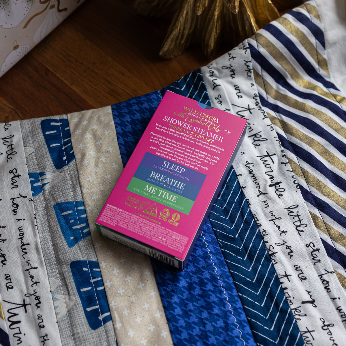 The pink back of the Cool and Clear box, listing Sleep, Breathe and Me Time and their scents.