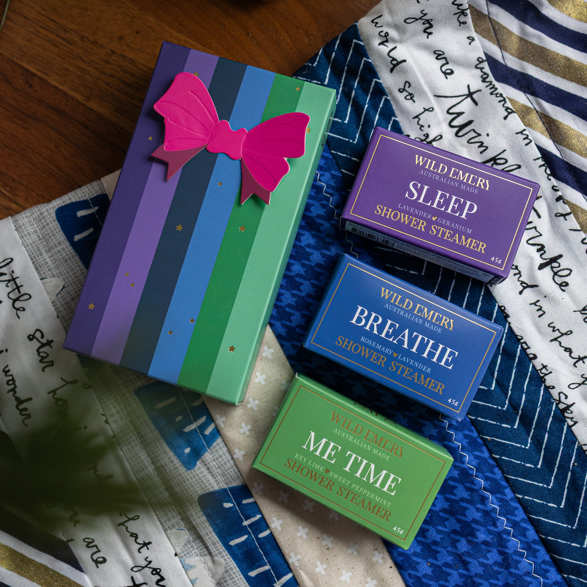 The striped Cool and Clear gift box with its three boxed steamers: Sleep, Breathe and Me Time.