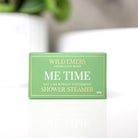 Green Me Time shower steamer box standing on a white surface.