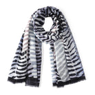 Scarf in a smoky zebra-stripe print of black, grey and blue, draped in a loop