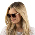 Blonde model wearing the Scarlett champagne sunglasses, head turned to the side