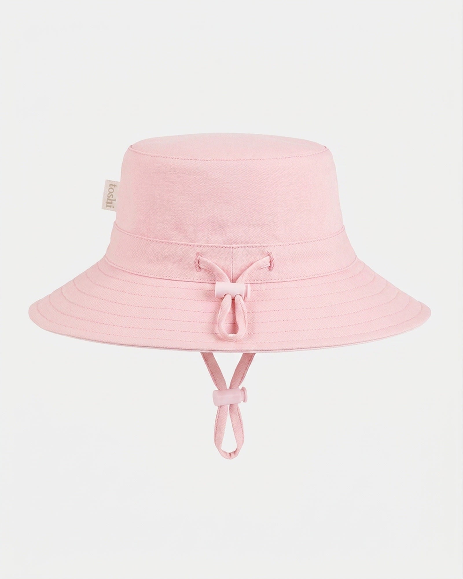 Toshi Olly bucket sunhat in plain soft pink with its adjustable head toggle and chin strap