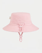 Toshi Olly bucket sunhat in plain soft pink with its adjustable head toggle and chin strap