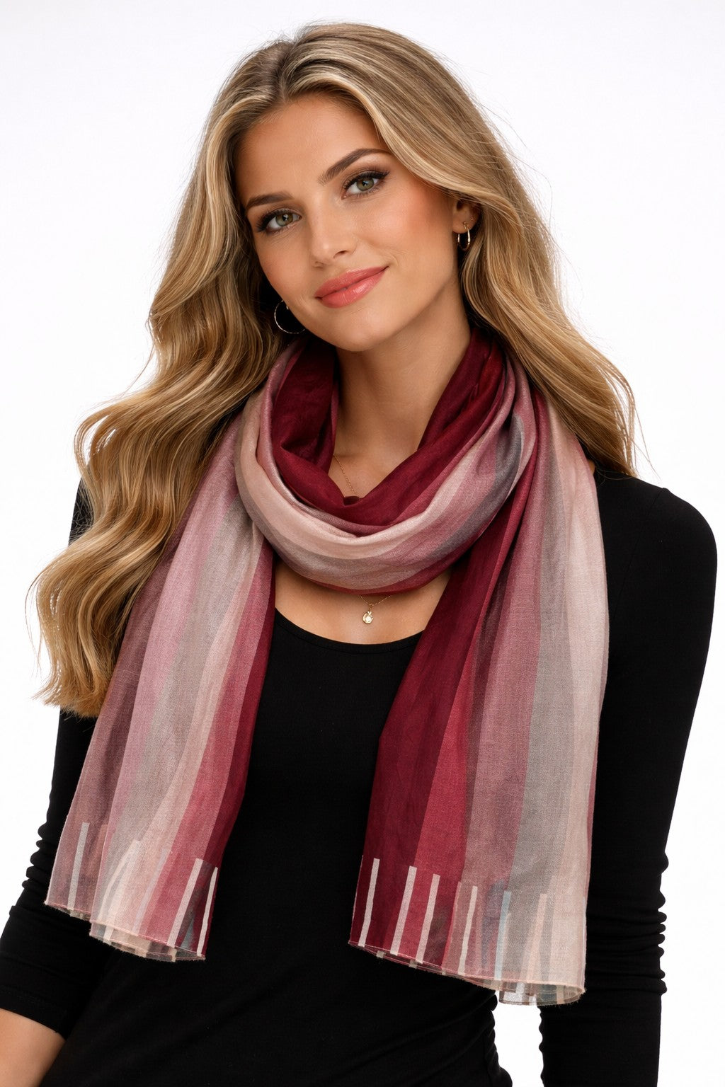 Sunset Spectrum Stripes silk scarf worn looped around the neck with a black top