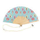 Open folding fan with natural wooden ribs and an aqua leaf printed with swimmers in rubber rings, cream wrist cord below