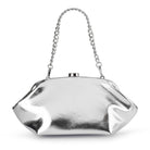 Silver clutch with its short chunky chain handle raised above the frame