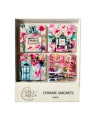 The Touch of Paris pack of four ceramic magnets in its box, on white.