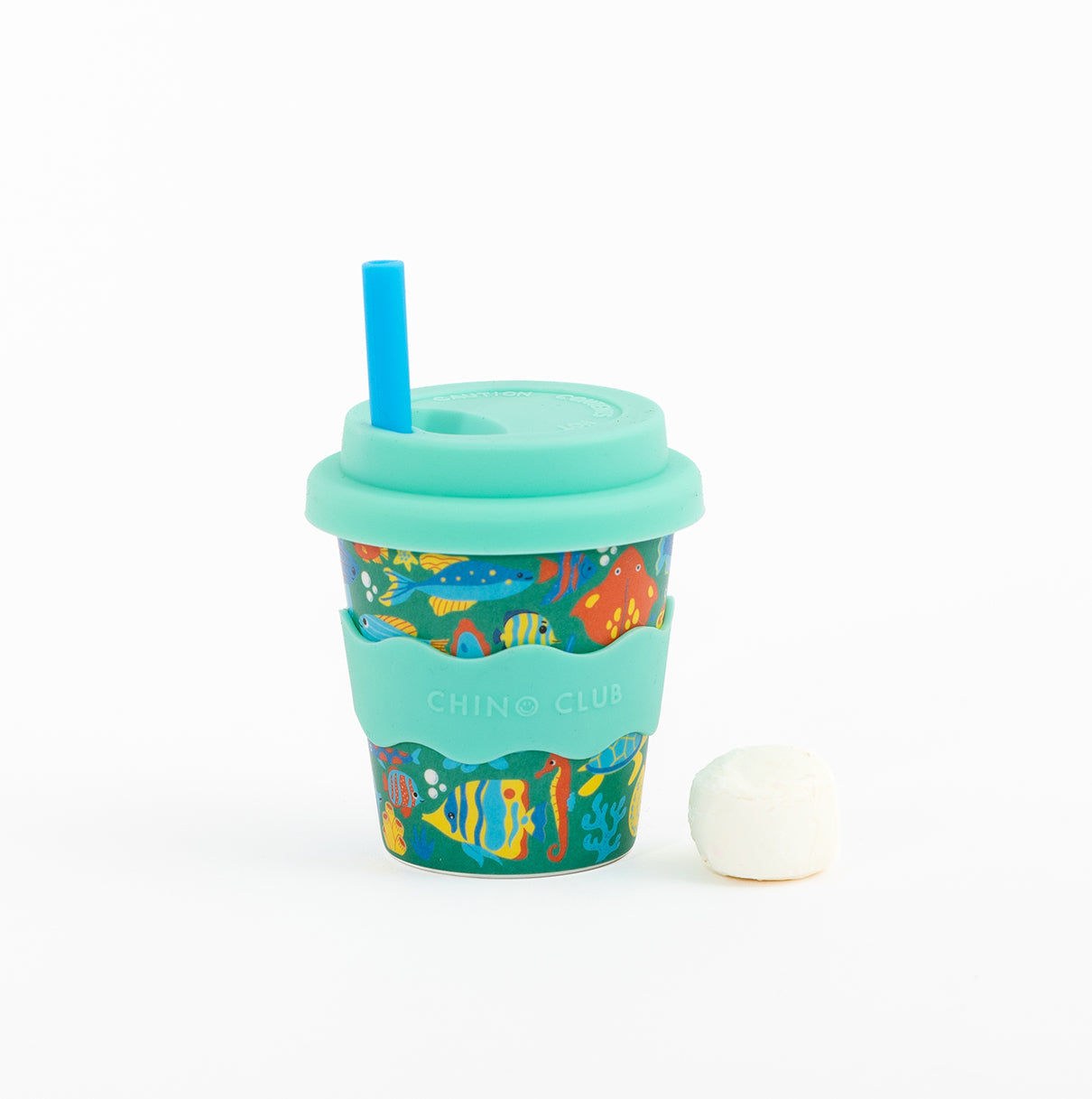 Tropical Ocean babychino cup: sea-creature print with a mint lid and wavy sleeve, a blue straw and a marshmallow beside it