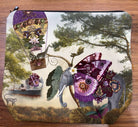 Velour cosmetic bag printed with Isabelle Frioux's Butterfly Elephant: an elephant with purple butterfly wings beside a hot-air balloon, with a black zip.