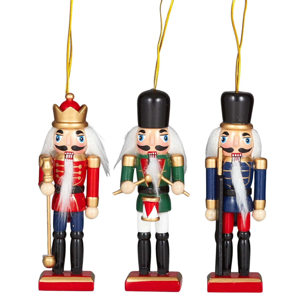 Three wooden nutcracker soldier ornaments in red, green and blue, each on a gold cord loop.