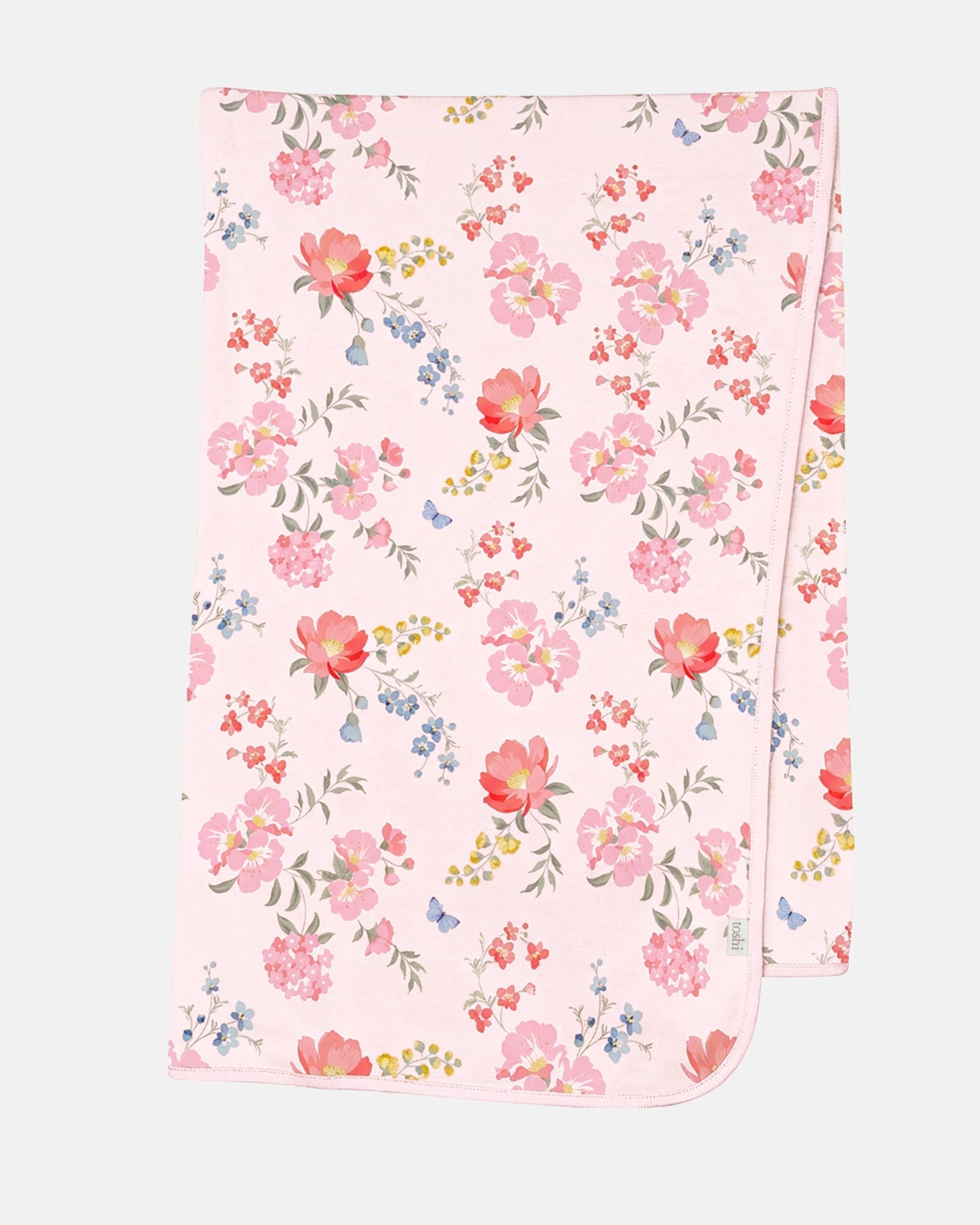 Toshi Arcadia Wild Garden knit wrap laid flat, pale pink jersey printed with pink and coral florals, small blue sprigs and butterflies