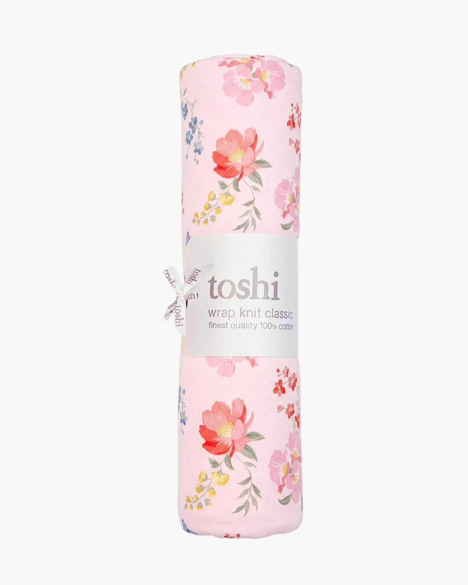The Wild Garden knit wrap rolled in its Toshi band with a ribbon tie