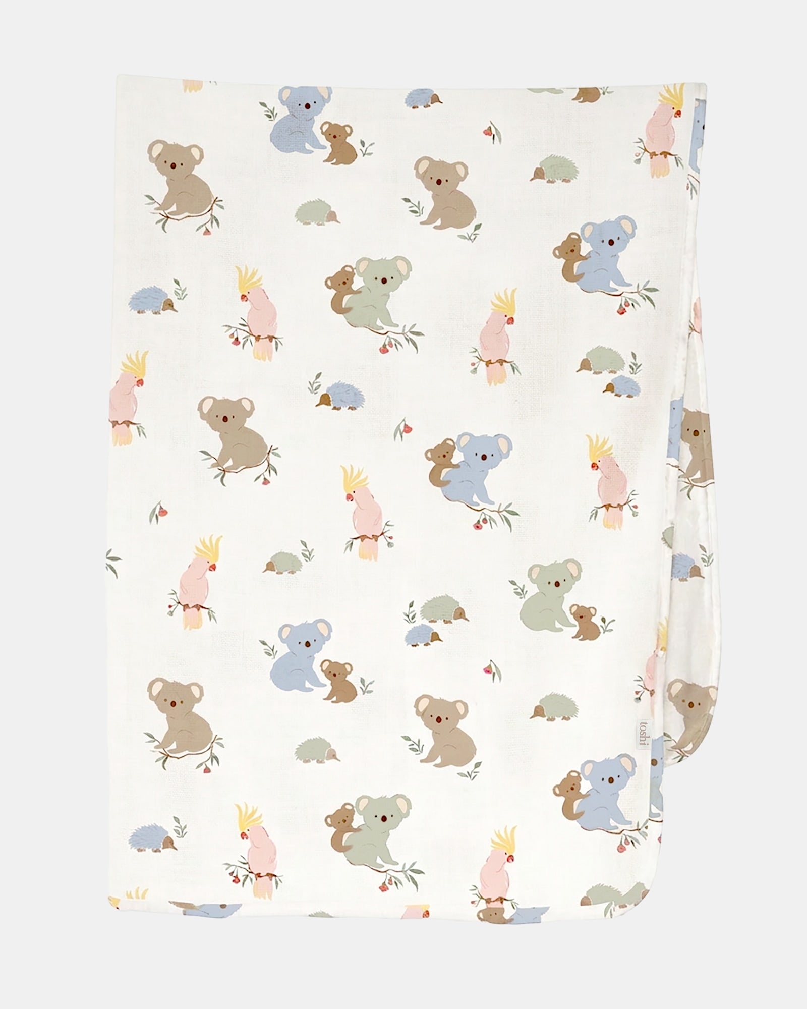 Toshi Arcadia Gumnut Babies muslin wrap in white cotton printed with koalas, cockatoos and echidnas, folded