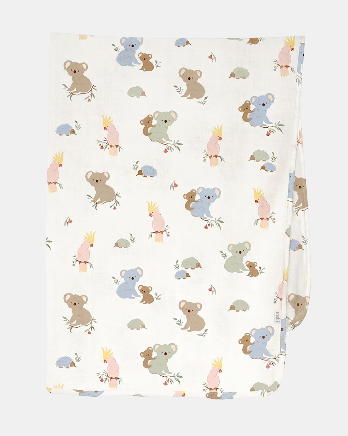 Toshi Arcadia Gumnut Babies muslin wrap in white cotton printed with koalas, cockatoos and echidnas, folded