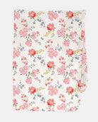 Toshi Arcadia Wild Garden muslin wrap in white cotton printed with pink and coral florals with blue blooms, folded