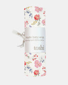 The Wild Garden wrap rolled in its Toshi muslin wrap band with a ribbon tie