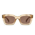 Front view of the Zahra Champagne sunglasses: a chunky translucent champagne rectangular frame with brown lenses