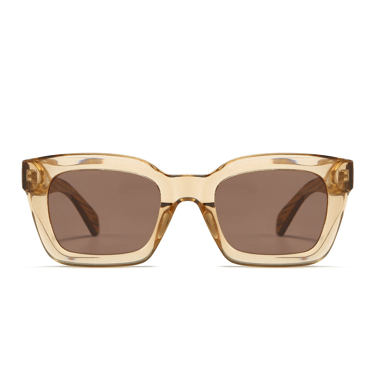 Front view of the Zahra Champagne sunglasses: a chunky translucent champagne rectangular frame with brown lenses