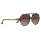 Billy sunglasses in opal tortoise at an angle, a mottled cream and brown frame with grained wood arms and brown gradient lenses