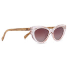 Savannah Blush Pink sunglasses at an angle: a clear pink cat-eye frame, brown gradient lenses and striped walnut arms