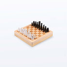 Angled view of the chess board with pieces arranged for play