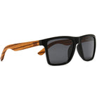 Dalton sunglasses at an angle: a black rectangular frame with pale grained wood arms and dark lenses