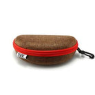 The hard sunglasses case that comes with the Dalton, in brown with a red zip