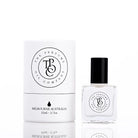 The Perfume Oil Company white gift cylinder beside a 10 ml bottle of perfume oil, studio lit on white