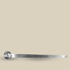 Long silver tea spoon engraved with The Tea Collective branding