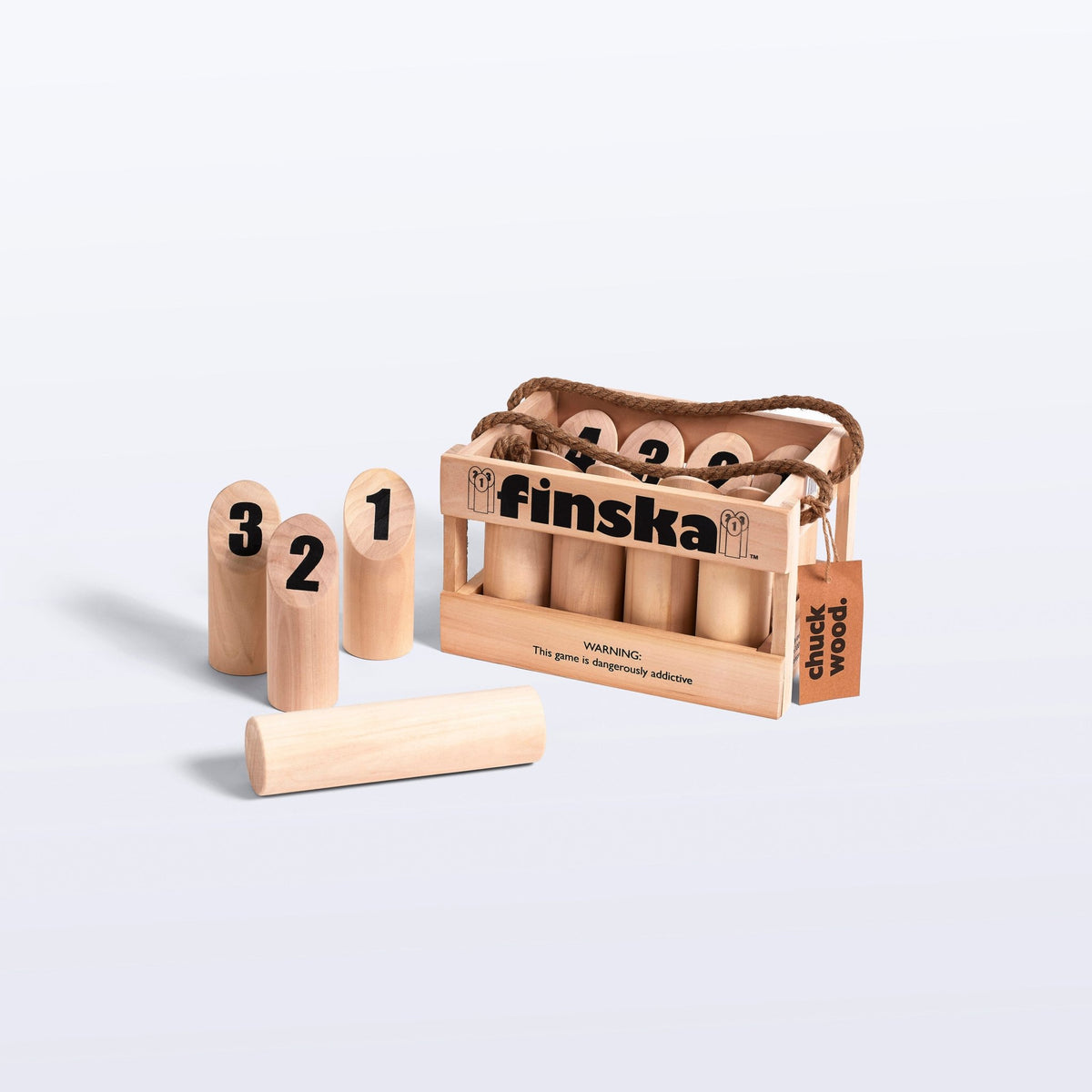 Finska birch carry crate with numbered pins, three pins standing and the throwing log in front