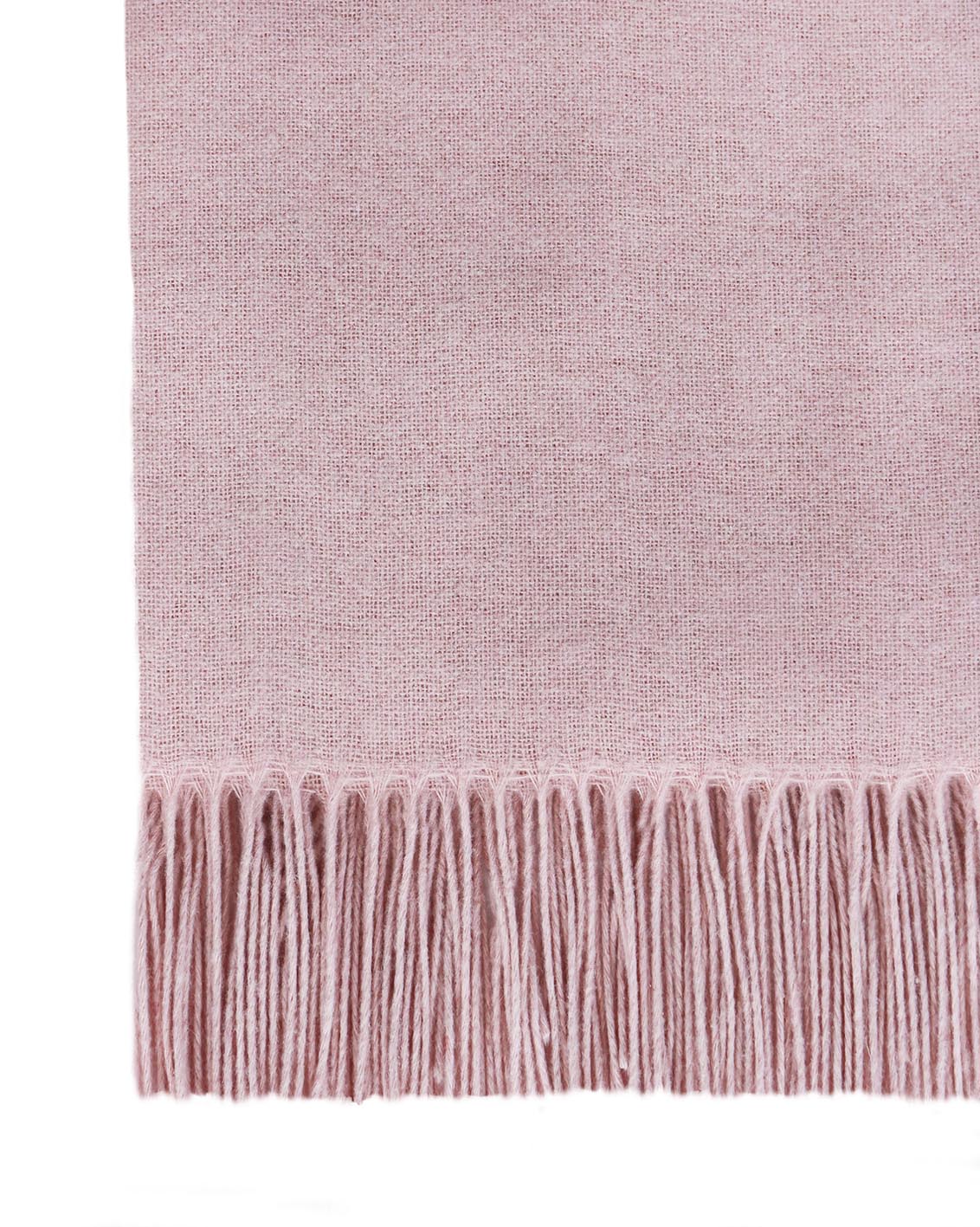 Close-up of the blush throw showing its soft dusty pink weave and long fringe