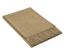 Camel-coloured merino wool blend throw folded with a knotted fringe along the front edge